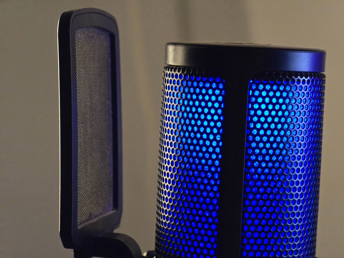A professional microphone in a studio setting representing content creation.