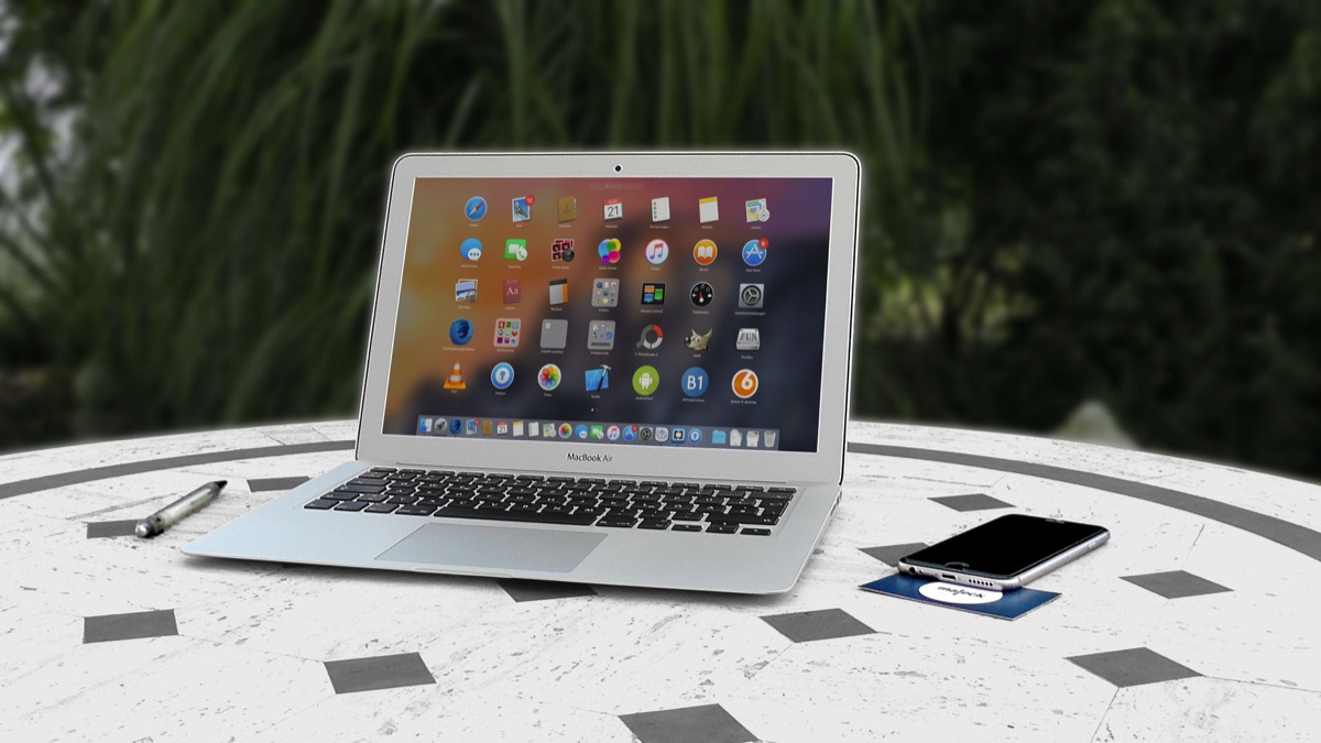 Smartphone and laptop on table showing digital branding strategy